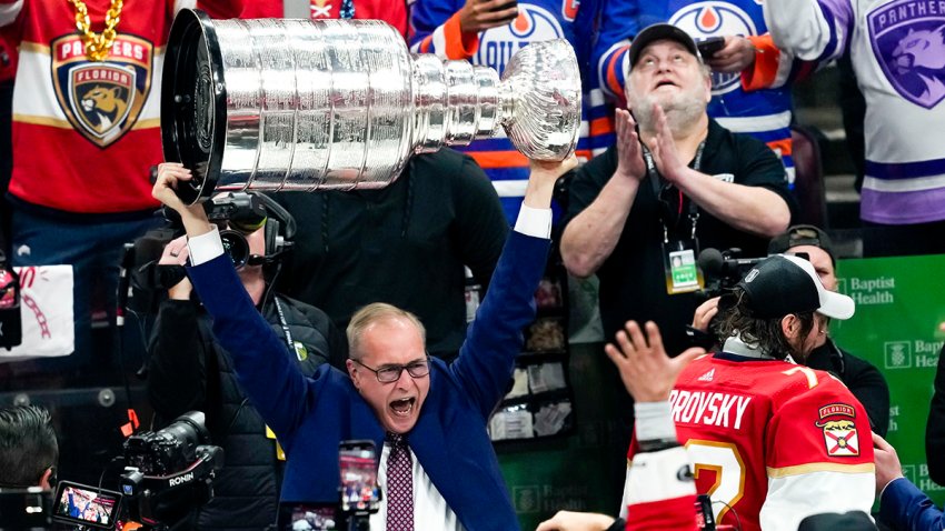 SUNRISE, FL – JUNE 24:  Florida Panthers head coach Paul Maurice raises the Stanley Cup  during the NHL Stanley Cup Finals, Game 7 between the Florida Panthers and Edmonton Oilers on June 24th, 2024 at Amerant Bank Arena in Sunrise, FL. (Photo by Andrew Bershaw/Icon Sportswire via Getty Images)