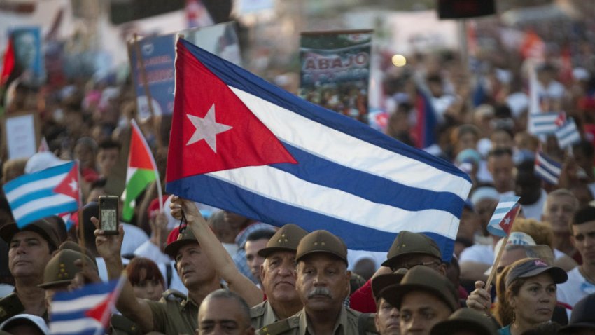 HAVANA, CUBA – MAY 1: A child holds a Palestinian flag as people gather to mark the International Labors’ Day in Havana, Cuba on May 1, 2024. People also showed their support with Palestinians during demonstration. (Photo by Yander Zamora/Anadolu via Getty Images)