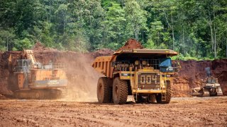 Heavy trucks seen working at a nickel mining area in Soroako, South Sulawesi, Indonesia.