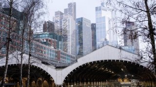 Liverpool Street train station beneath the new skyline of skyscrapers in the City of London financial district on 14th February 2022 in London, United Kingdom.