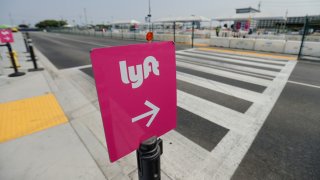 An empty Lyft pickup area is shown as ride-share drivers hold a rally as part of a statewide day of action to demand that ride-hailing companies Uber and Lyft follow California law and grant drivers “basic employee rights,” in Los Angeles on Aug. 20, 2020.