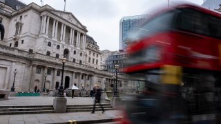 Blurred buses pass the Bank of England in the City of London on 7th February 2024 in London, United Kingdom. 