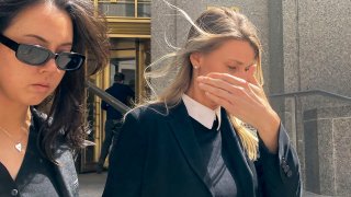 Aimee Harris, right, walks out of Manhattan federal court, Tuesday, April 9, 2024, in New York.