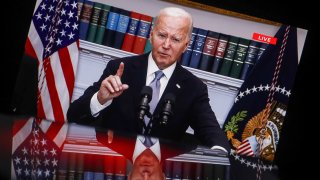 In this photo illustration showing a screen, current US President Joe Biden is seen speaking from the Roosevelt Room of the White House in Washington. President Biden and Vice President Harris held a briefing to discuss the incident and express support for Donald Trump. 