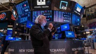 Traders work on the floor of the New York Stock Exchange on July 24, 2024.