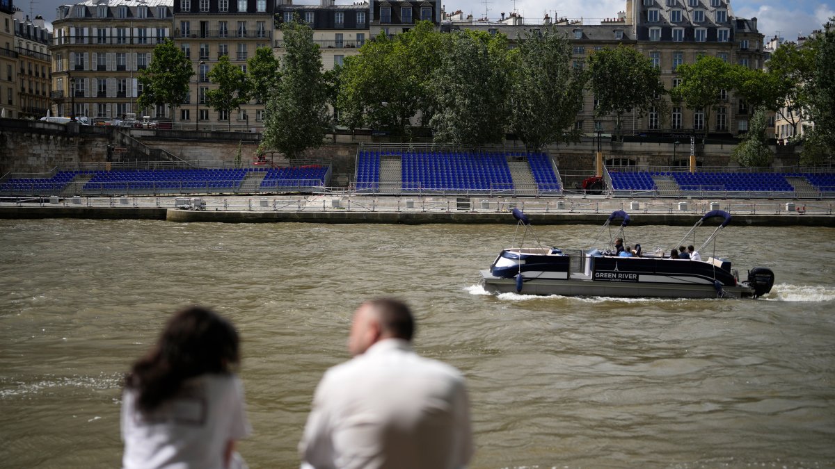 French sports minister swims in Seine River ahead of Paris Olympics