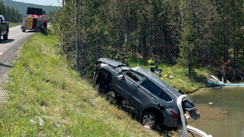 In this photo provided by the National Park Service, a sports utility vehicle is pulled from the inactive Semi-Centennial Geyser in the Wyoming area of Yellowstone National Park on Friday, July 12, 2024. The passengers were able to get out of the acidic, 105 degree Fahrenheit (41 degrees Celsius) water on their own and were taken to the hospital for treatment of non-life-threatening injuries after the crash Thursday morning, park spokesperson Morgan Warthin said in a statement.