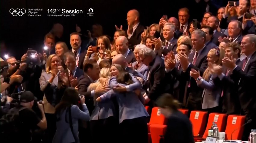 An audience reacts to news in Paris