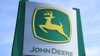 John Deere signage at the World Agriculture Expo in Tulare, California, US, on Tuesday, Feb. 13, 2024.