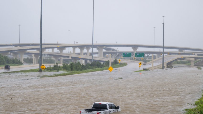 HOUSTON, TEXAS – JULY 08: A vehicle is left abandoned in floodwater on a highway after Hurricane Beryl swept through the area on July 08, 2024 in Houston, Texas. Tropical Storm Beryl developed into a Category 1 hurricane as it hit the Texas coast late last night. (Photo by Brandon Bell/Getty Images)