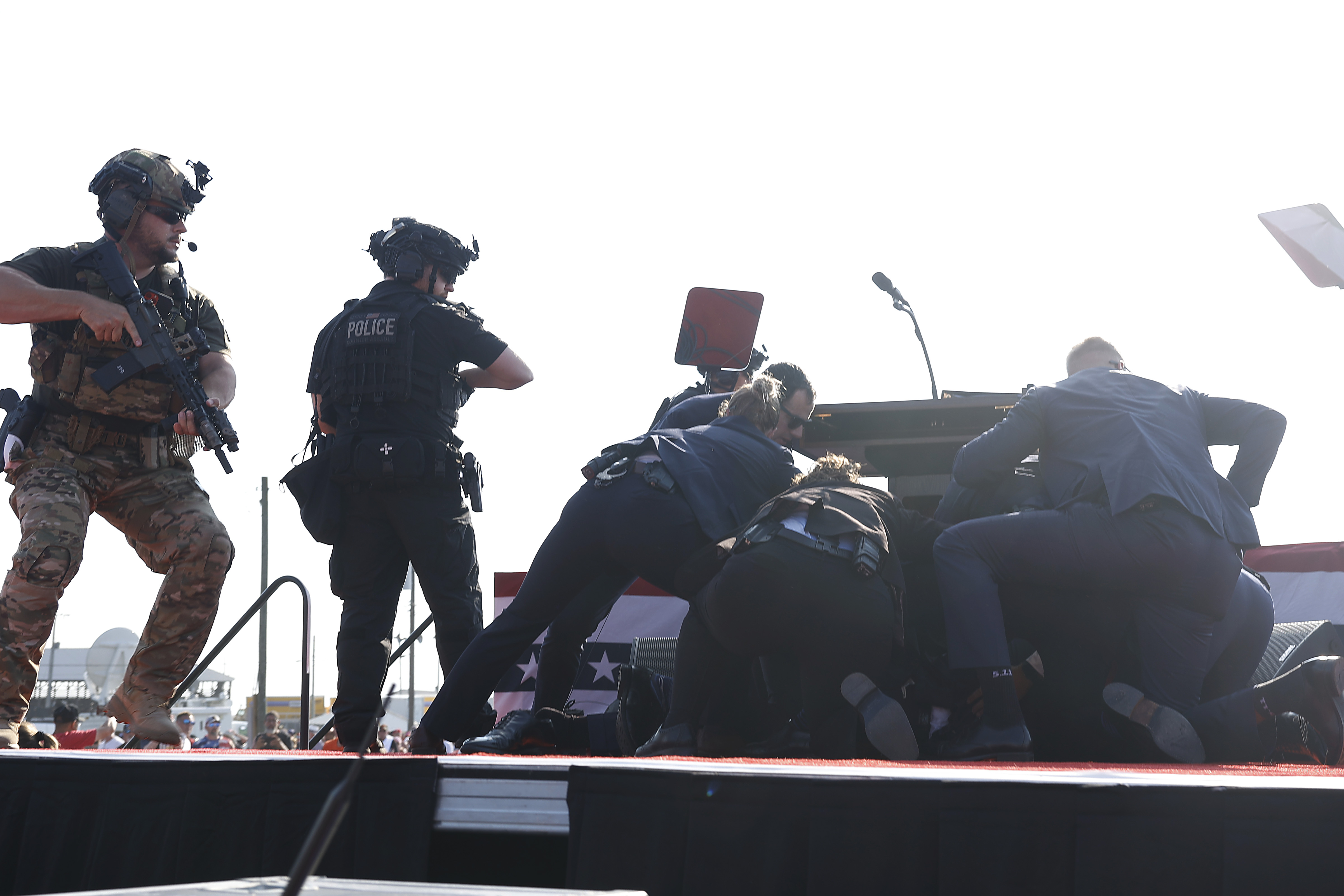 Republican presidential candidate former President Donald Trump is rushed offstage during a rally on July 13, 2024 in Butler, Pennsylvania.