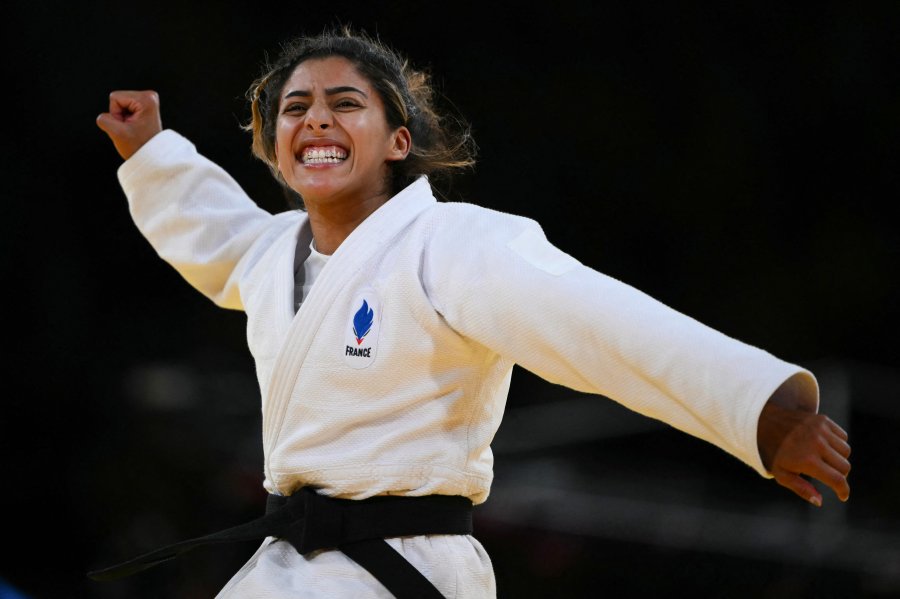 France's Shirine Boukli reacts after beating Spain's Laura Martinez Abelenda (Blue) in the judo women's -48kg bronze medal