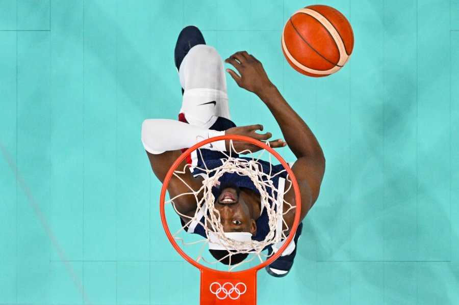 An overview shows USA's Bam Adebayo go for a rebound in the men's preliminary round group C basketball match