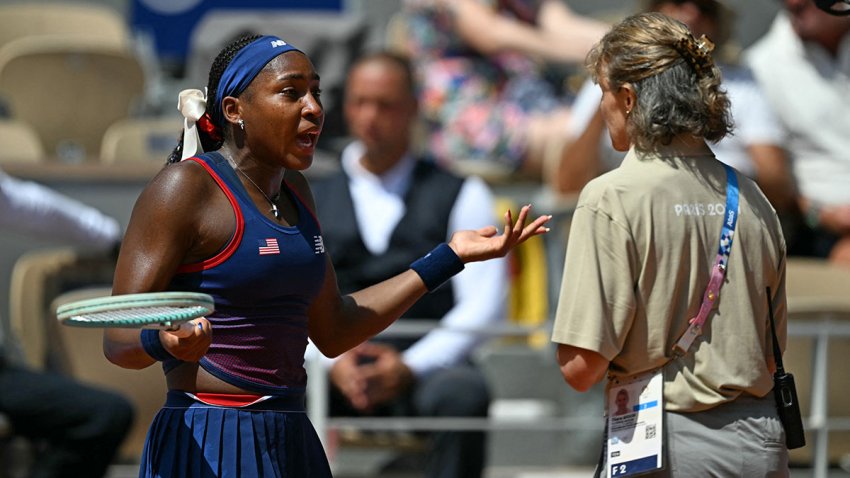 US’ Coco Gauff speaks with an official after a call goes against her while playing Croatia’s Donna Vekic during their women’s singles third round tennis match on Court Philippe-Chatrier at the Roland-Garros Stadium during the Paris 2024 Olympic Games, in Paris on July 30, 2024. (Photo by PATRICIA DE MELO MOREIRA / AFP) (Photo by PATRICIA DE MELO MOREIRA/AFP via Getty Images)