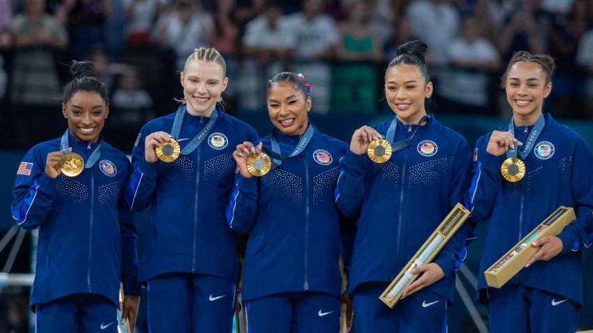 The United States team of Simone Biles, Jade Carey, Jordan Chiles, Sunisa Lee, and Hezly Rivera