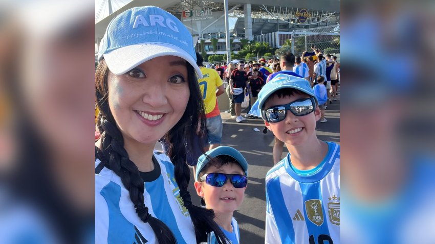 Hwang and her two sons at the Hard Rock stadium