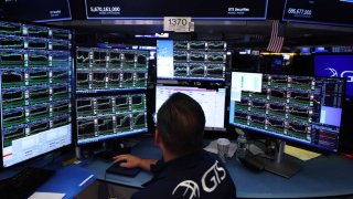 Traders work on the floor of the New York Stock Exchange.