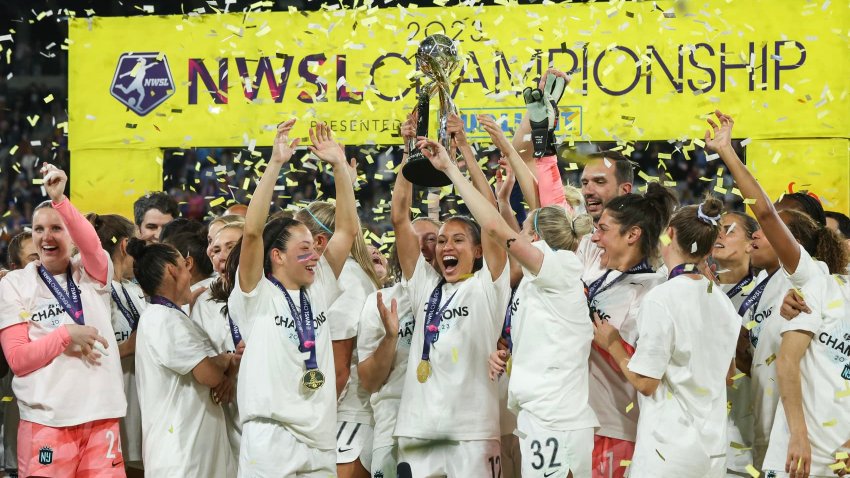 Kristen Edmonds #12 of NJ/NY Gotham FC raises the NWSL Championship trophy after defeating the OL Reign during the 2023 NWSL Championship game at Snapdragon Stadium on November 11, 2023 in San Diego, California.