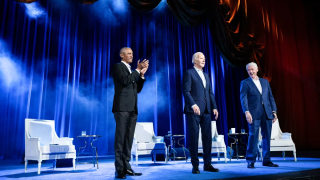 Barack Obama, Joe Biden, and Bill Clinton on stage at an event