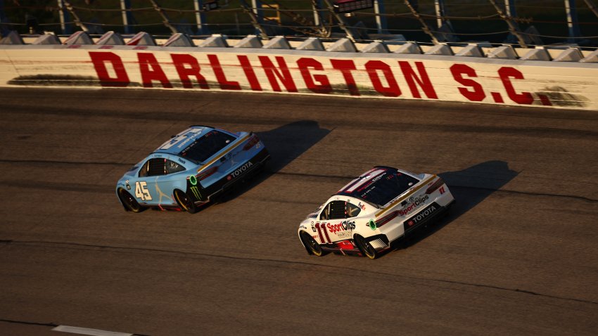 Tyler Reddick, driver of the No. 45 Jordan Brand Toyota, and Denny Hamlin, driver of the No. 11 Sport Clips Haircuts Toyota, race