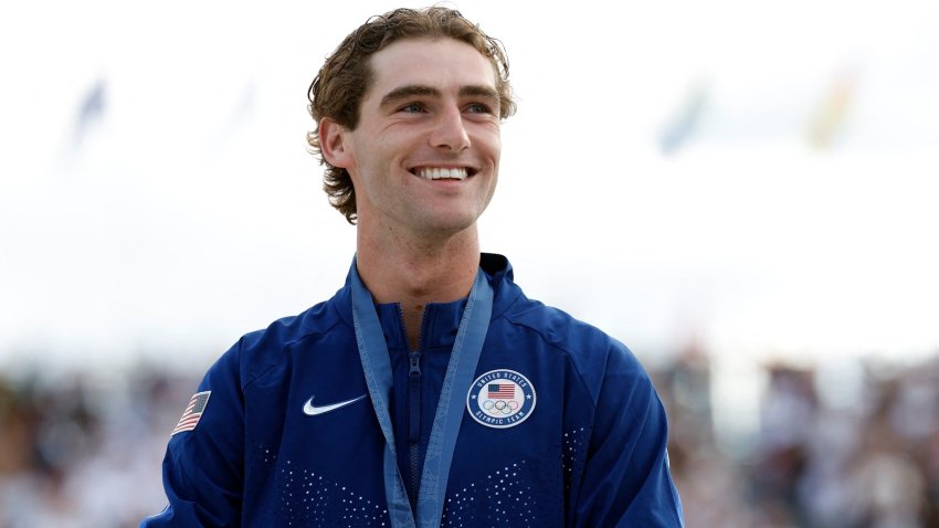 Tom Schaar at an Olympic medal ceremony.