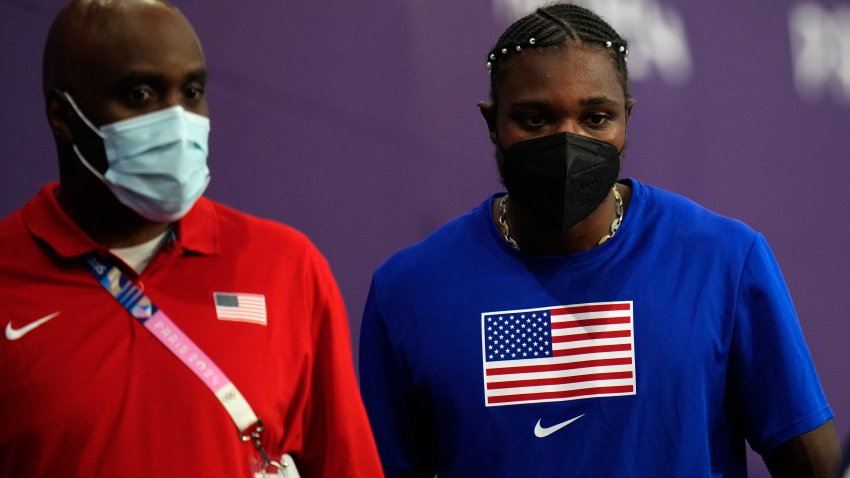 Noah Lyles, of the United States, dons a face mask following his men’s 200-meters final at the 2024 Summer Olympics, Thursday, Aug. 8, 2024, in Saint-Denis, France. (AP Photo/Petr David Josek)