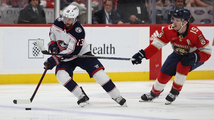 SUNRISE, FLORIDA – APRIL 11: Johnny Gaudreau #13 of the Columbus Blue Jackets skates with the puck against Matthew Tkachuk #19 of the Florida Panthers during the second period of the game at Amerant Bank Arena on April 11, 2024 in Sunrise, Florida. (Photo by Megan Briggs/Getty Images)