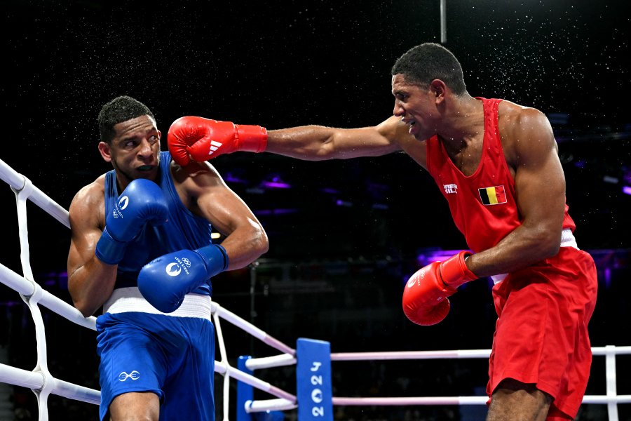 Belgium's Victor Schelstraete punches Spain's Enmanuel Reyes Pla in the men's 92kg quarter-final boxing match during the Paris 2024 Olympic Games at the North Paris Arena, in Villepinte on August 1, 2024