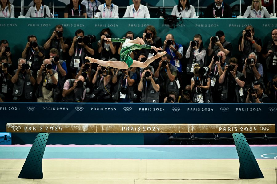 China's Zhou Yaqin competes in the artistic gymnastics women's balance beam final during the Paris 2024 Olympic Games at the Bercy Arena in Paris, on August 5, 2024