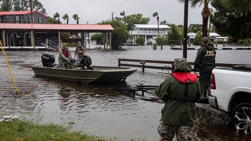 Officers with the Florida Fish and Wildlife Commission return from looking for stranded residents after Hurricane Debby made landfall in Suwannee, Florida, US, on Monday, Aug. 5, 2024. Tropical Storm Debby threatens to unleash days of heavy rain and flooding on the US East Coast after slamming into Florida as a hurricane, knocking out power to thousands. Photographer: Christian Monterrosa/Bloomberg via Getty Images