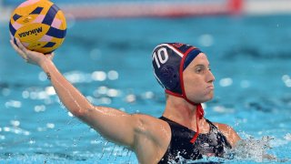 US’ #10 Kaleigh Gilchrist shoots the ball in the women’s water polo quarterfinal match between Hungary and USA during the Paris 2024 Olympic Games at the Paris La Defense Arena in Paris on August 6, 2024. (Photo by Andreas SOLARO / AFP) (Photo by ANDREAS SOLARO/AFP via Getty Images)