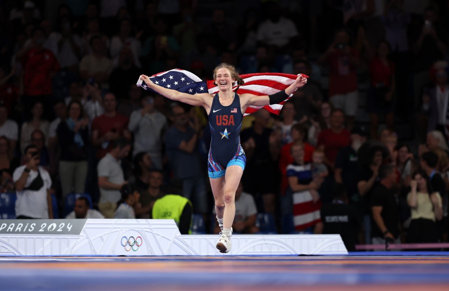 Sarah Hildebrandt celebrates with the United States flag