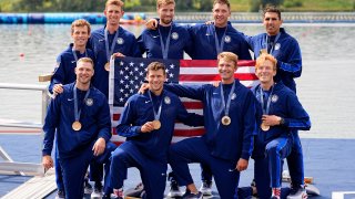 Aug 3, 2024; Vaires-sur-Marne, France; Team USA poses for a photo with their medals in the mens eights during the Paris 2024 Olympic Summer Games at Vaires-sur-Marne Nautical Stadium. Mandatory Credit: Sarah Phipps-USA TODAY Sports