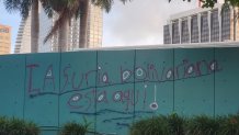 The Bayfront Park Trust is offering a ,000 reward for the person responsible for graffiti that officials say was meant to threaten the Venezuelans who protested there on Saturday. 