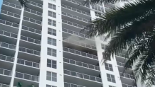 Smoke pours from a Miami Beach condo unit during a fire on Sept. 3, 2024.