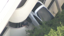 A Porsche SUV was left dangling from a parking garage in Coral Gables on Sept. 23, 2024.