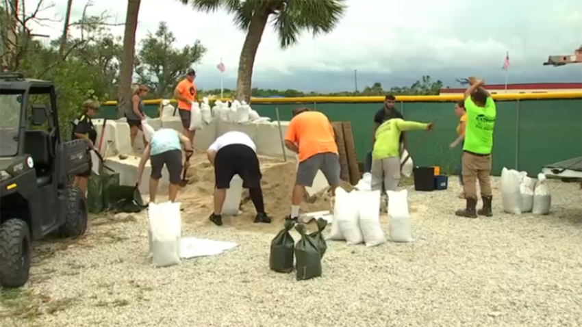 As Hurricane Helene was gaining strength in the Gulf of Mexico Wednesday, residents of Fort Myers Beach were getting to work to prepare for impacts from the powerful storm.