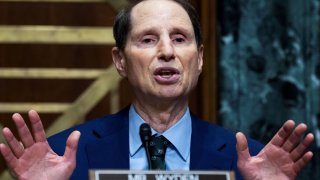 Senate Finance Committee Chairman Ron Wyden, D-Ore., questions IRS Commissioner Charles Rettig at a Senate Finance Committee hearing.