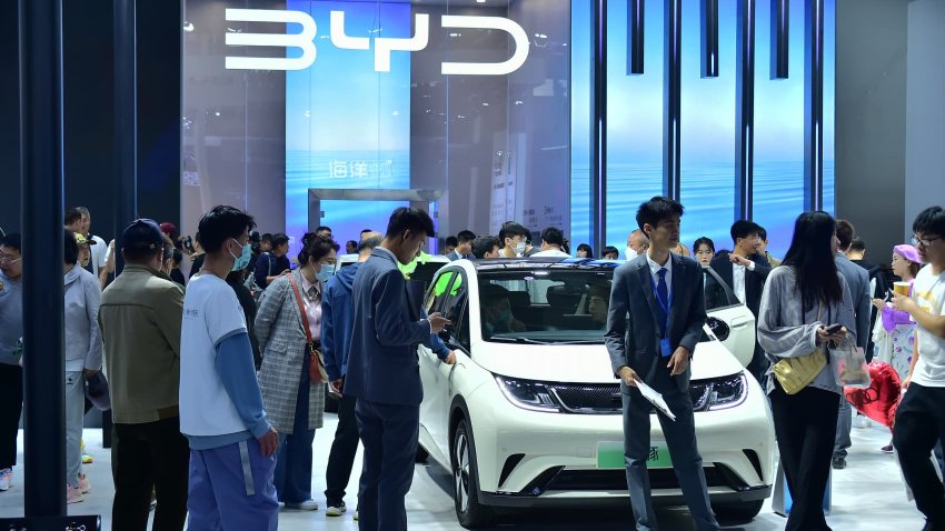 People look at a BYD Dolphin electric subcompact during the 2023 Shenyang International Auto Show on May 3, 2023 in Shenyang, Liaoning Province of China.