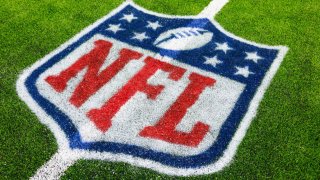 A detailed view of the NFL shield logo on the field during a preseason game between the Los Angeles Rams and the Houston Texans at NRG Stadium in Houston on Aug. 24, 2024.