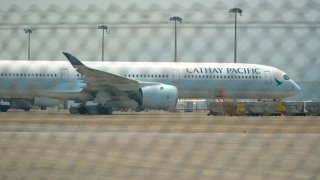 An Airbus SE A350 aircraft operated by Cathay Pacific Airways Ltd. on the tarmac at Hong Kong International Airport in Hong Kong, China, on Tuesday, Sept. 3, 2024. 