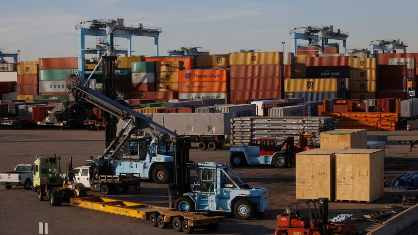 Shipping yard equipment sits parked near containers at the Port of Virginia APM Terminal in Portsmouth, Virginia, U.S.