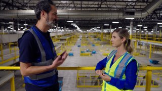 Amazon’s vice president of transportation technology and services Steve Armato talks to CNBC’s Katie Tarasov at Amazon’s largest California sort center in Tracy, California, on July 31, 2024.