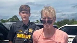 Ryan W. Routh, suspected of attempting to assassinate Republican presidential nominee and former U.S. President Donald Trump at his West Palm Beach golf course, stands handcuffed between two Martin County Sheriff’s office deputies after his arrest during a traffic stop near Palm City, Florida, U.S., September 15, 2024.