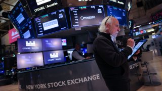 A trader works on the trading floor at The New York Stock Exchange (NYSE) following the Federal Reserve rate announcement, in New York City, U.S., September 18, 2024. 