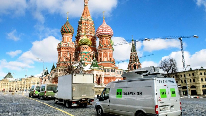 Russian state-controlled Russia Today television broadcast vans parked in front of St. Basil’s Cathedral and the Kremlin next to Red Square in Moscow on March 16, 2018.