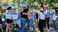 Sarah McBride, center, with supporters in Wilmington during Delaware’s primary election day on Sept. 10.