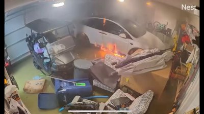 Video shows flooded Tesla catch fire inside Pinellas County garage