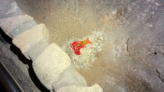 This undated photo provided by Carlsbad Caverns National Park shows a bag of Cheetos that was dropped off trail by a visitor in the Big Room at the national park near Carlsbad, N.M.