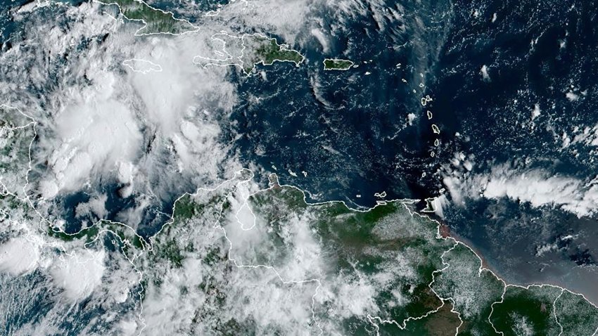 This image provided by the National Oceanic and Atmospheric Administration shows a cluster of storms located south of the Cayman.